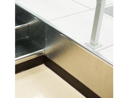 Closure kit shown at the side of a step entry way. Without closure kit, the underside of the floor would be revealed.