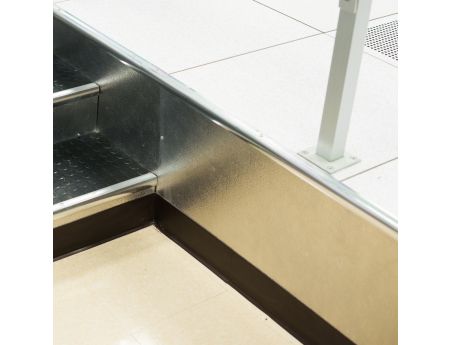 Closure kit shown at the side of a step entry way. Without closure kit, the underside of the floor would be revealed.
