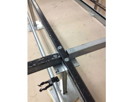 Stringers are rods that form a basic grid which provides lateral stability for raised floors